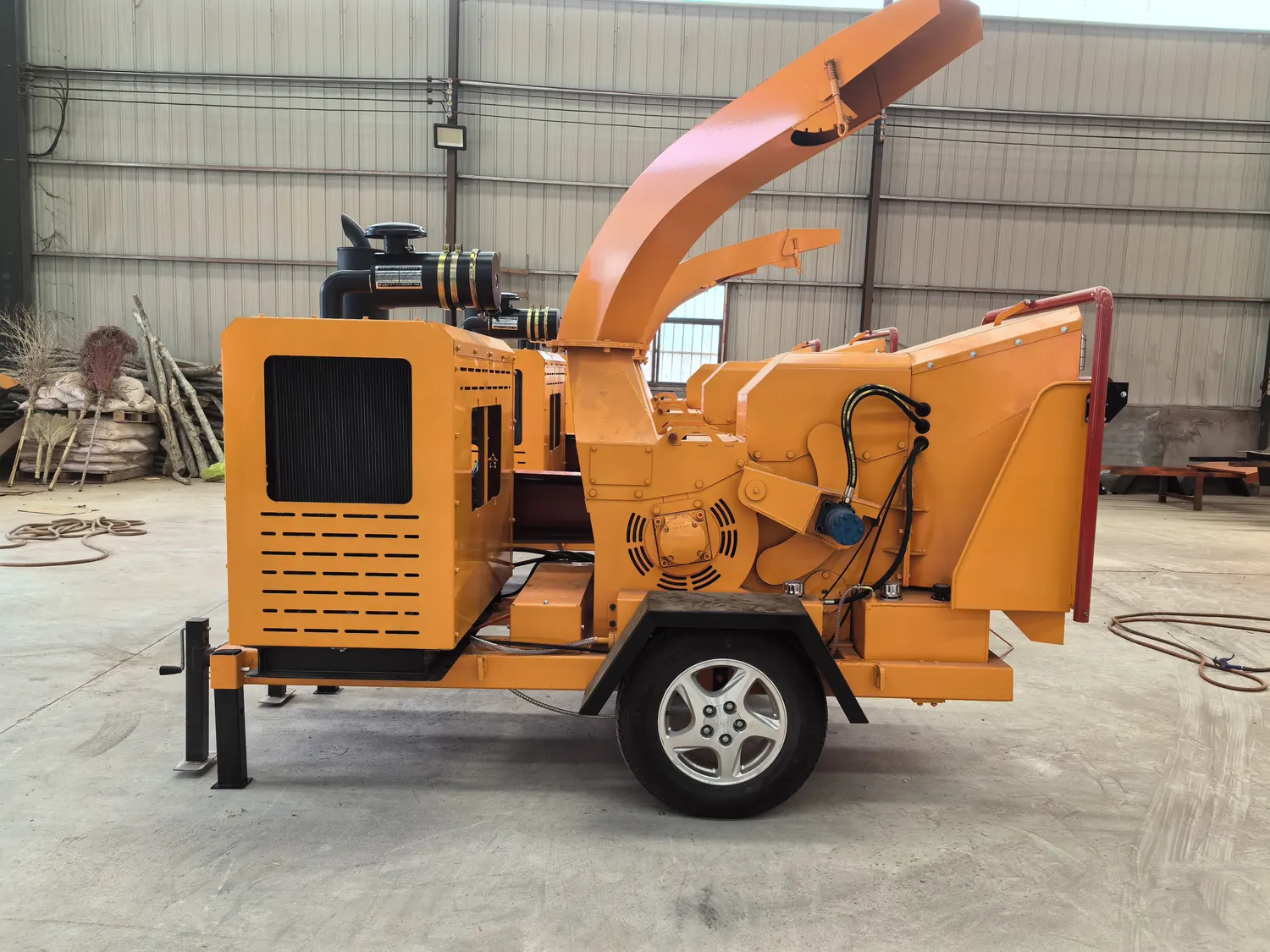 Rear feed hopper and safety control bar of a Cronus wood chipper